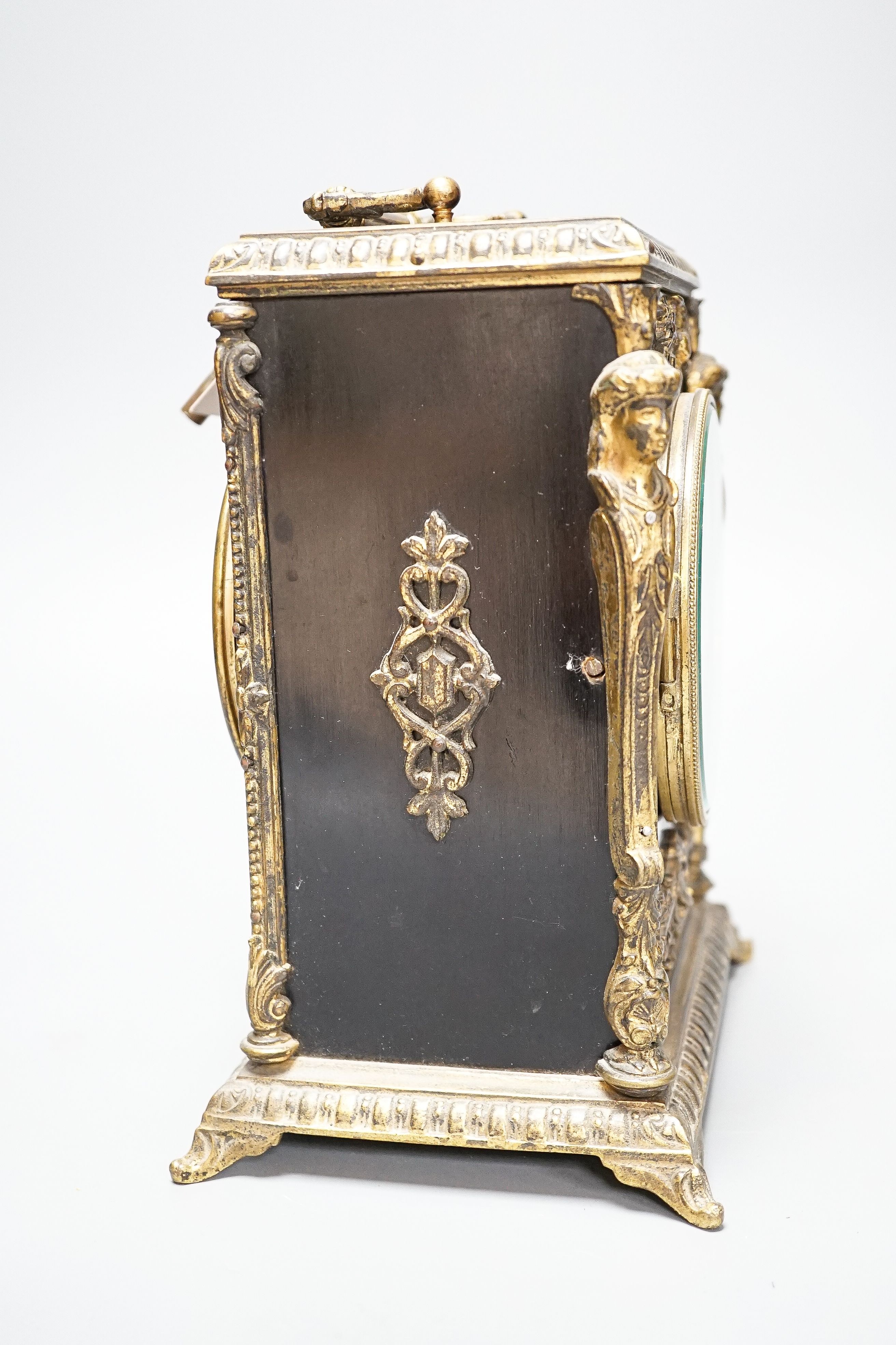 A 19th century French ebonised and ormolu-mounted mantel clock with key, 27cm including handle